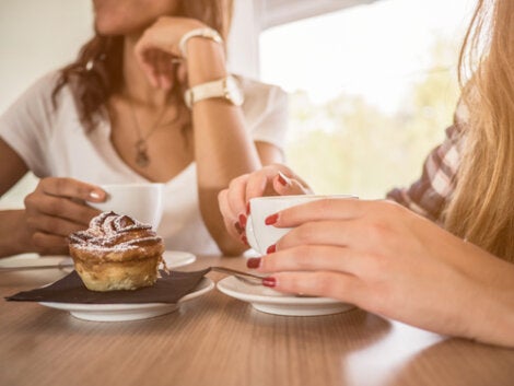 Two friends having a coffee together.