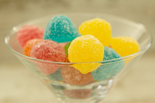 A bowl full of fruit snacks.