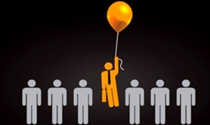 A man floating on a balloon.