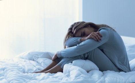 A woman sitting in bed.