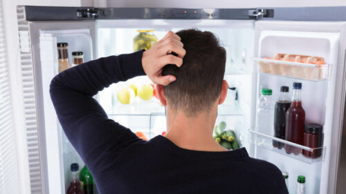 A person looking in the fridge.