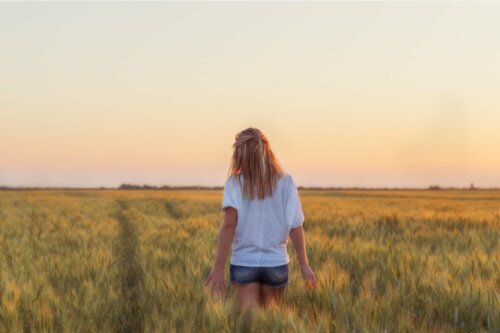 A woman in a field who knows you can't always get what you want.