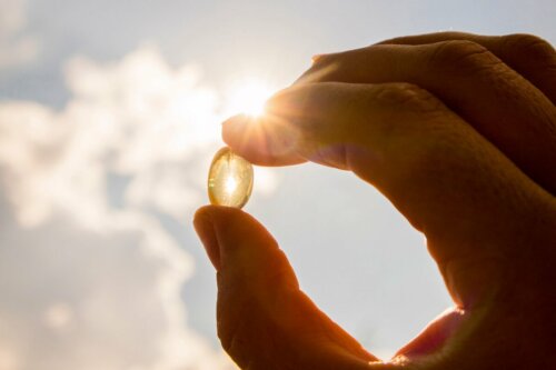 Looking at the sun through a vitamin C pill to improve mood.