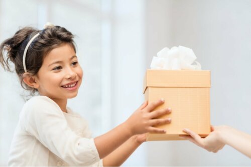 A girl receiving a present.