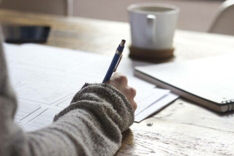 A person writing notes.
