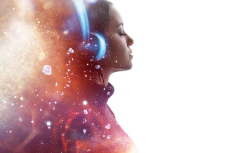 A woman listening to music.