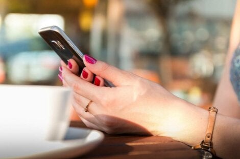 A woman holding a cell phone.