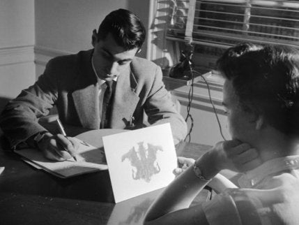A psychiatrist conducting the Rorschach test.