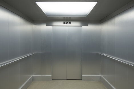 The inside of an elevator.