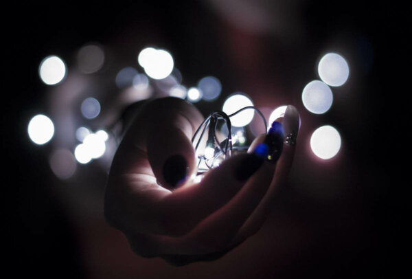 A hand holding a light.