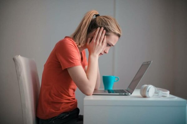 A seemingly upset woman in a computer.