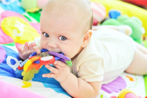 A baby playing working on sensory development.
