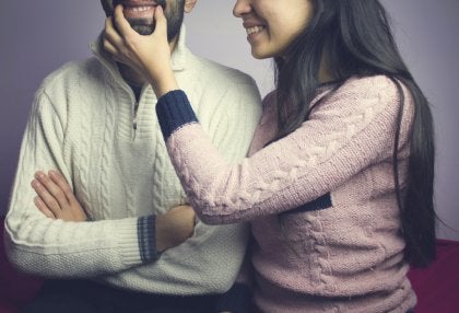 A girl making her boyfriend smile.