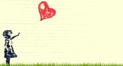 A girl with a heart baloon.