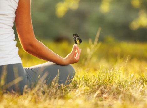 A woman meditating who isn't frightened by silence.