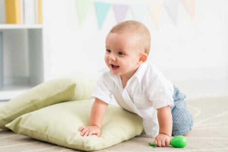 A baby on a pile of pillows.