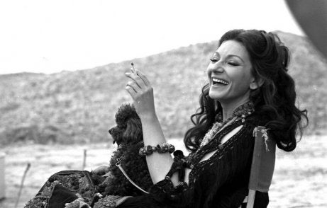 A photo of Maria Callas laughing.