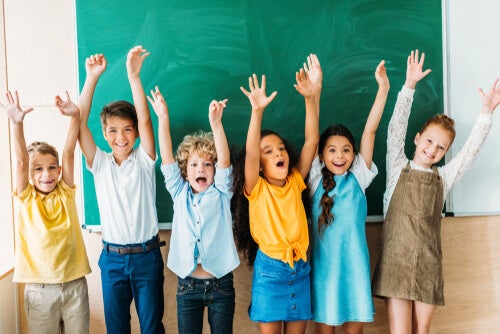 A group of children cheering.
