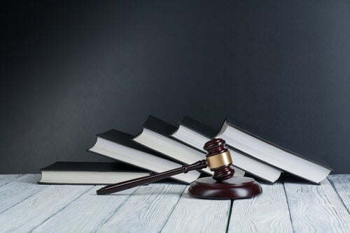 A stack of books of laws and regulations.