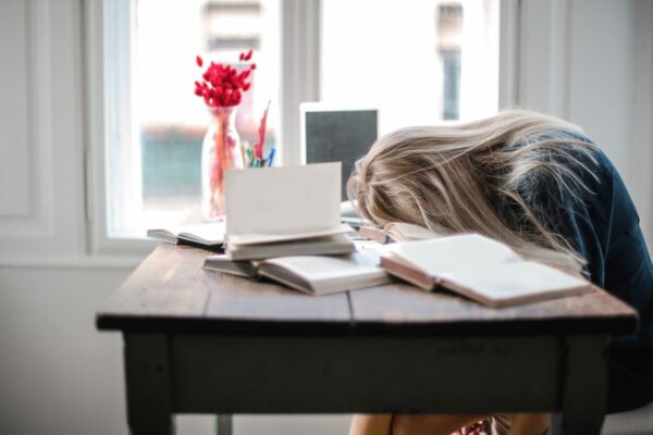 A woman sleeping on her face.