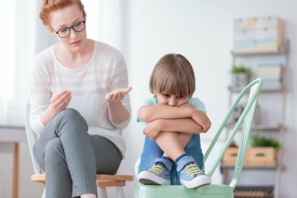 A woman talking to a child.