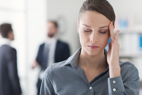 A woman with a headache.