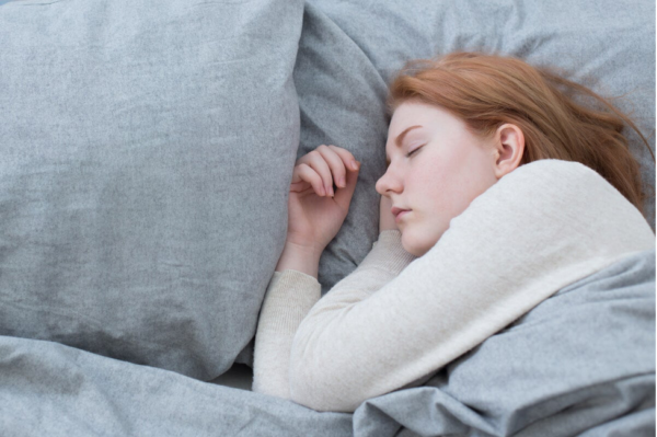 A teenager sleeping.