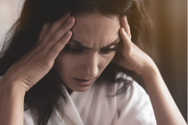 A woman looking stressed.