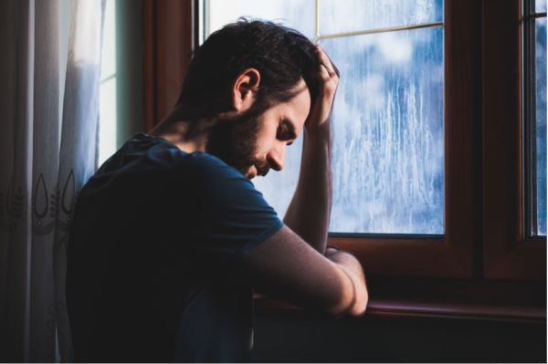 A man looking depressed.
