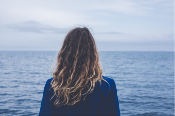 A woman looking out to sea.
