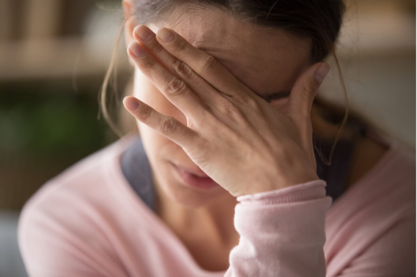 A woman looking distressed.
