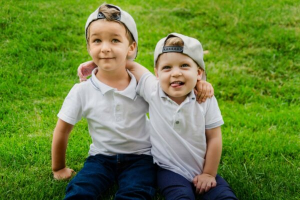 Two brothers hugging.