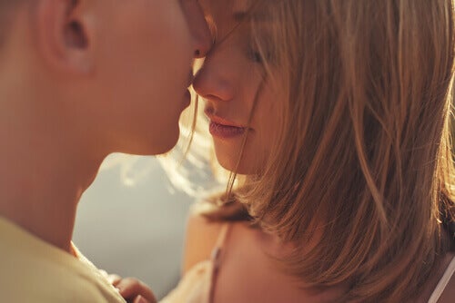 Two people kissing.