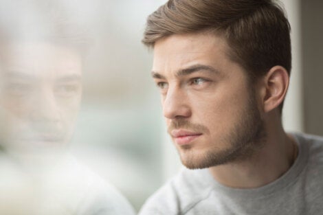 A man looking out a window.