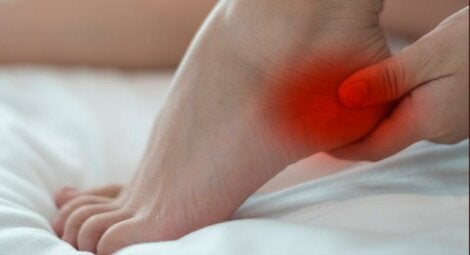 A woman holding her heel.