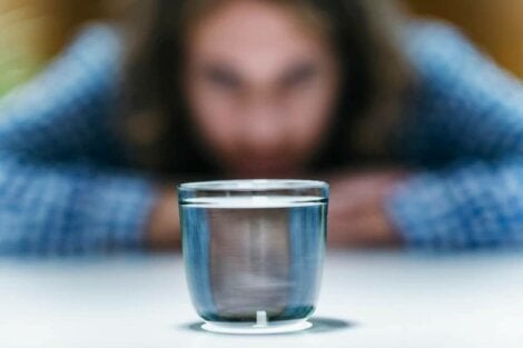 A woman in front of a glass.