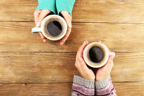 Two people drinking coffee.