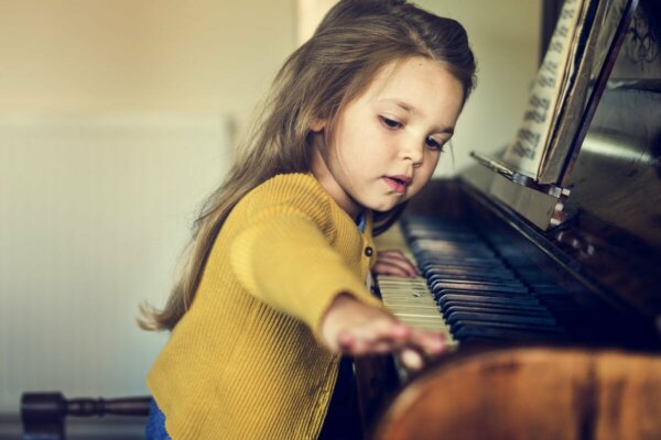 A girl playing the piano.