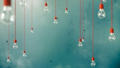 A bunch of lightbulbs hanging from the sky.