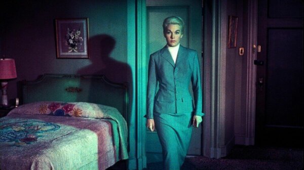Kim Novak in a bedroom.