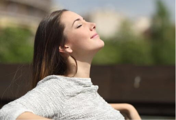 A woman breathing deeply.