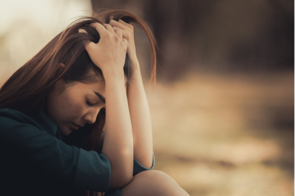 A woman looking unhappy.