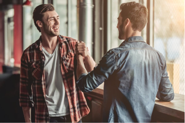 Two friends shaking hands.