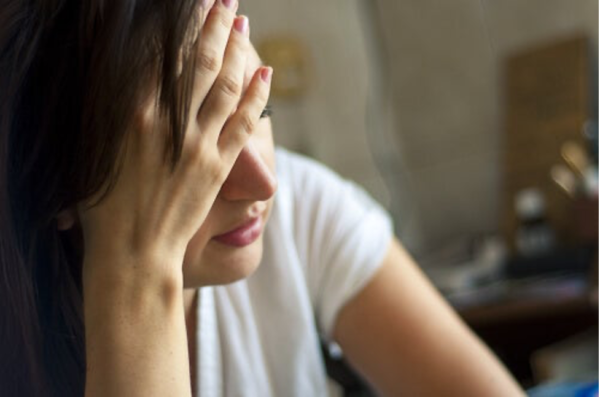 A woman looking stressed.