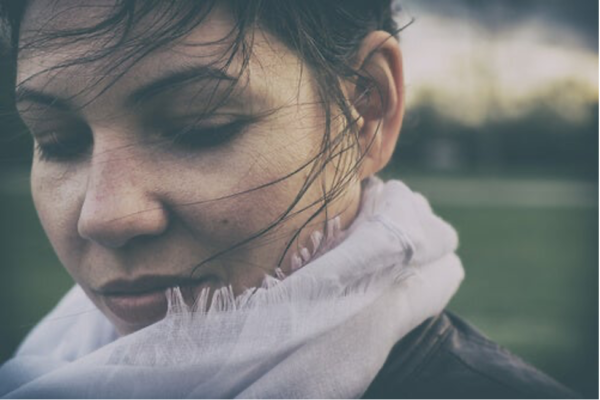 A woman looking thoughtful.