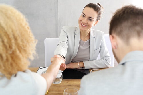 Two people shaking hands.