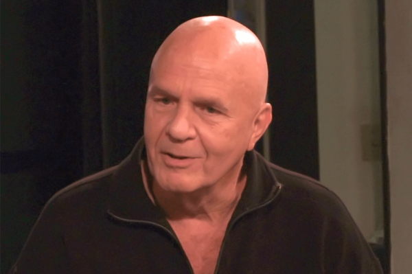 Wayne Dyer talking to someone.