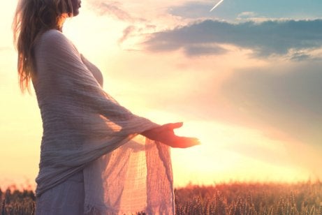 A woman embracing the sunset.