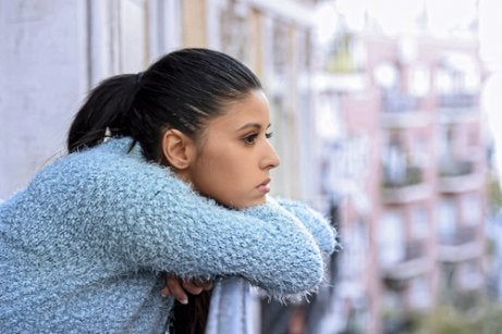 A woman looking out at the city.