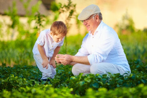A child and his grandfather enjoy time together outdoors.